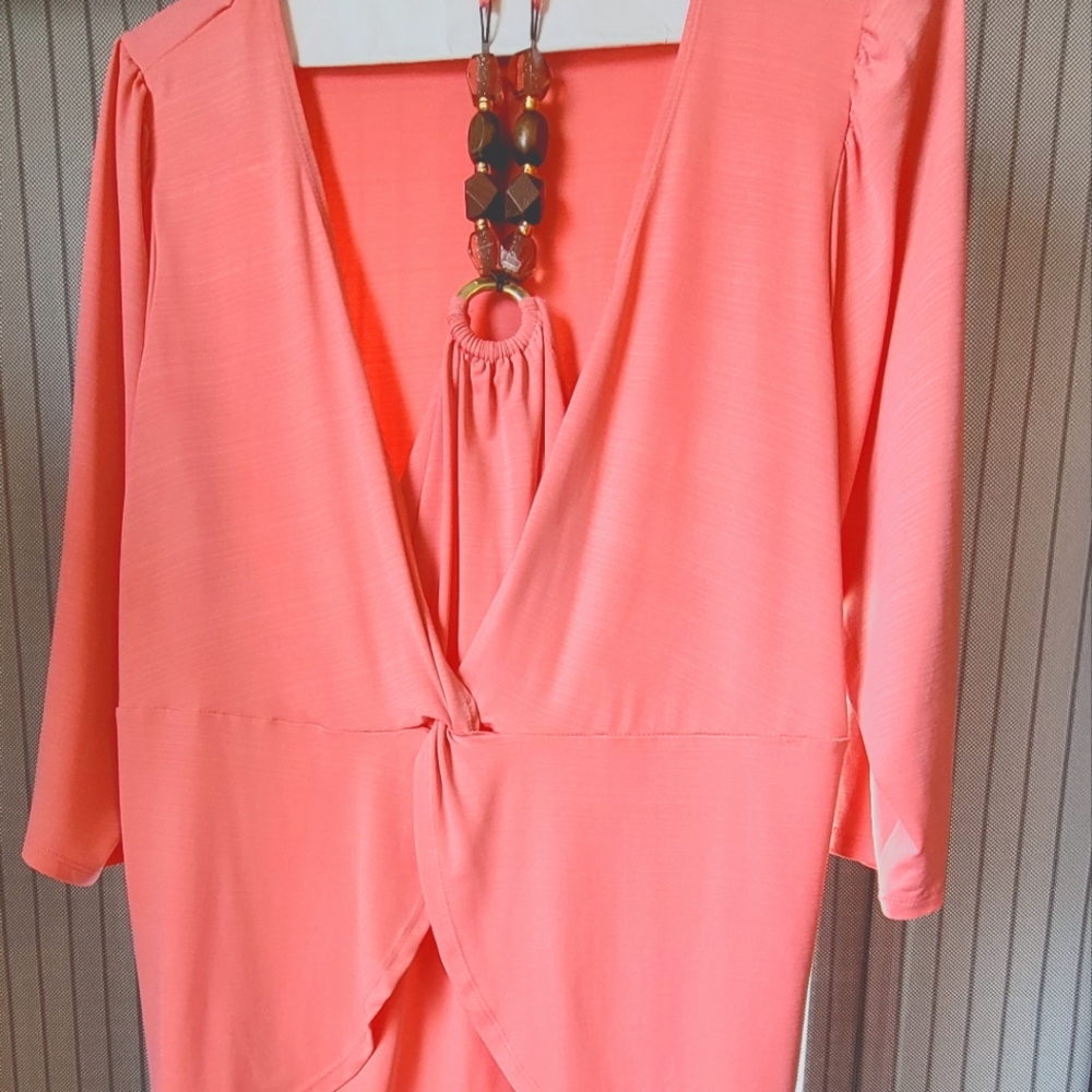 Coral shirt with tie around necklace